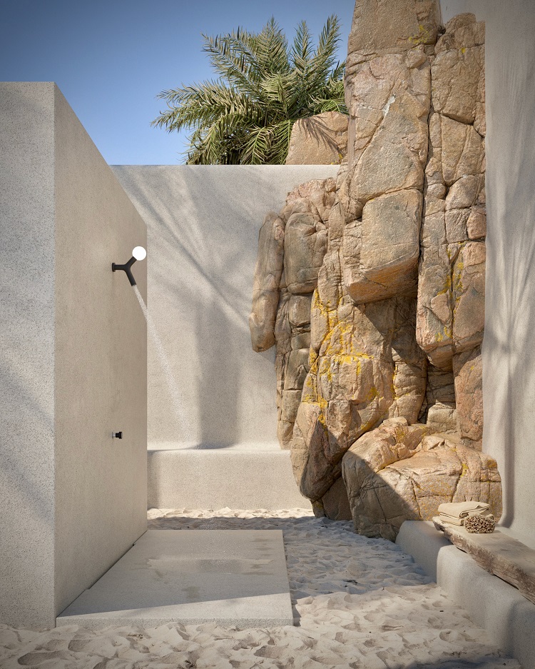 doccia esterna con pavimento di sabbia e pareti di roccia