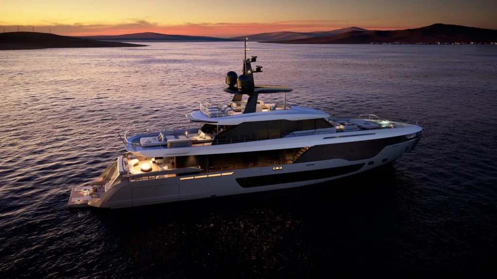 Azimut Grande 36M all'ancora al tramonto con le luci di bordo accese