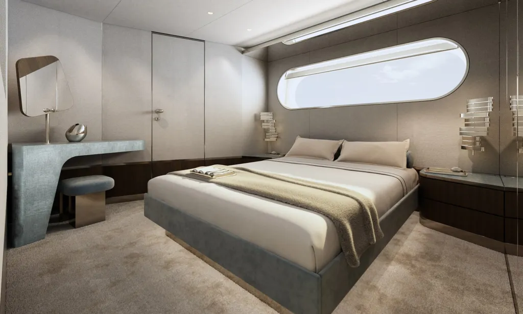 Cabina ospiti del Magellano 30M con letto matrimoniale, scrittoio e oblò allungato