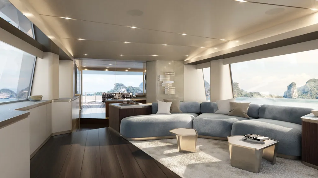 Salone del ponte superiore del Magellano 30M con divano azzurro e finestrature panoramiche