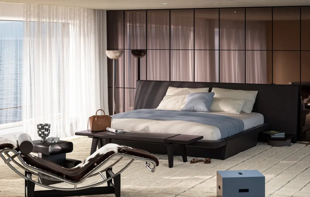 Cabina armatoriale di uno yacht con letto Cassina e chaise longue LC4