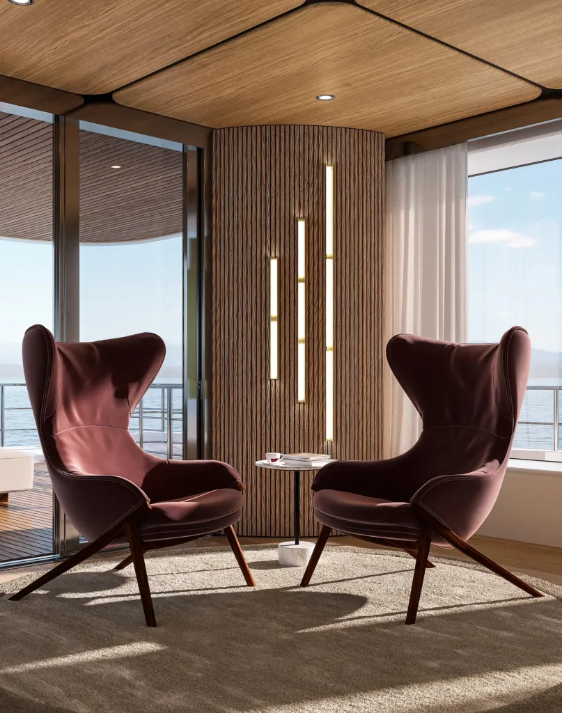 Due poltrone Cassina in velluto bordeaux davanti alla vetrata di uno yacht