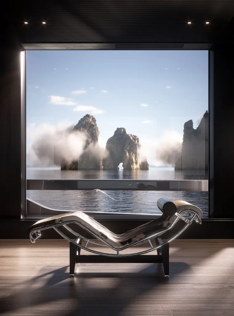 Chaise longue LC4 di Cassina davanti a una vetrata sui Faraglioni, a bordo di uno yacht