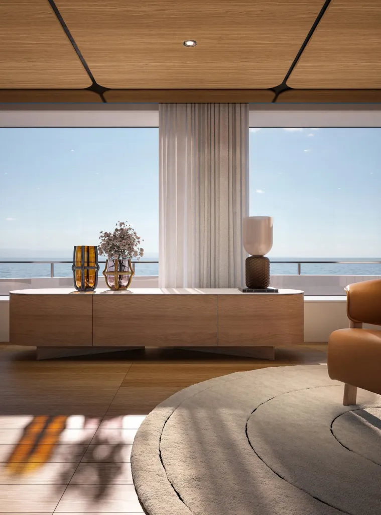 Panca e madia in legno Cassina davanti alle finestrature di uno yacht sul mare