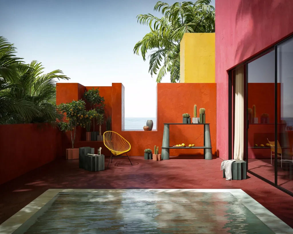 Terrazza in stile messicano con pareti rosse, piscina e arredi in cemento Forma&Cemento