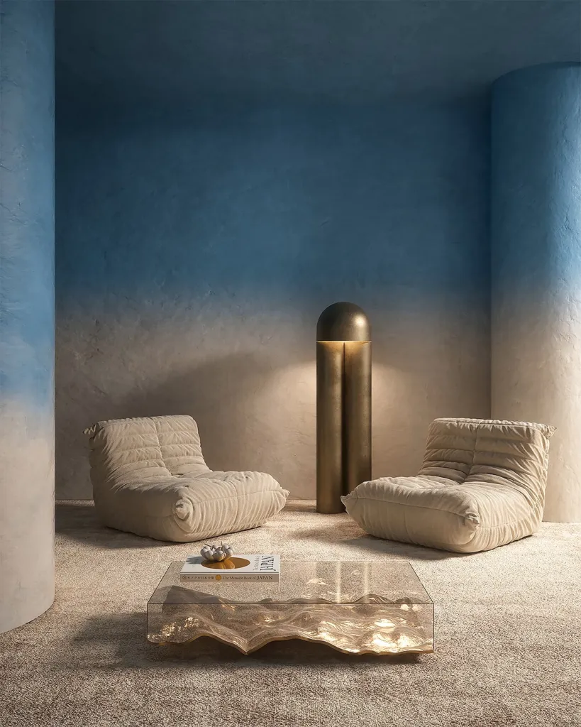 Gradient, living con pareti sfumate in azzurro, divani morbidi e tavolino scultoreo