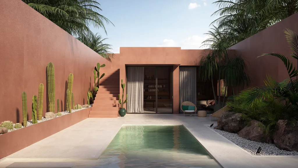 Piscina in un patio con pareti rosse e cactus, superfici Laminam